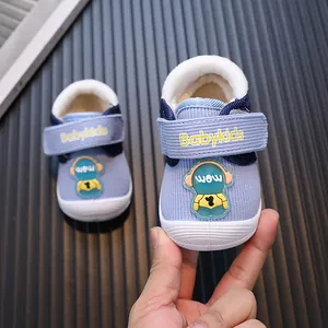Cozy plush-lined baby walking shoes with cute cartoon design for 0-2 year old toddlers.