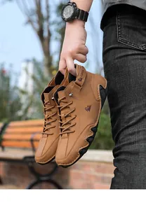 Close-up of brown men's casual high-top boots with octopus sole texture