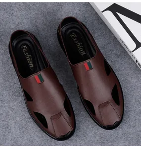 Detailed view of brown leather men's casual sandals with red and green web stripe