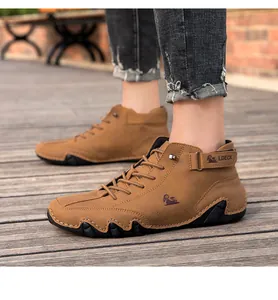 Close-up of brown men's high-top casual boots with durable octopus rubber sole