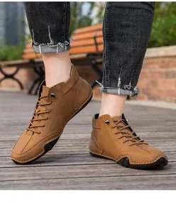 Detailed view of men's brown high-top casual boots with octopus anti-slip rubber sole