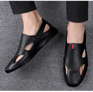 Close-up of the soft leather texture and hollow-out side design on black men's sandals.
