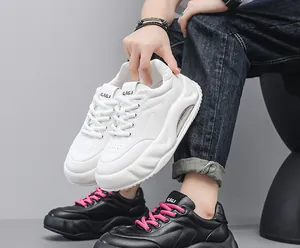 Close-up of men's chunky sneakers with thick air cushion soles and leather texture