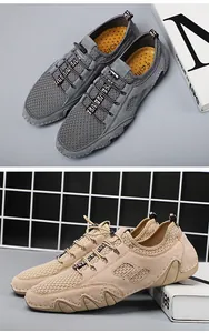 Detailweergave van ademende heren sneakers van varkensleer en mesh in grijs en beige