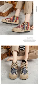 Close-up of ethnic totem pattern high-top linen shoes with thick platform jute soles