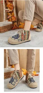 Detailed macro view showing ethnic totem patterns on linen high-top platform shoes