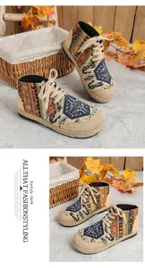 Detail view of ethnic totem linen high-top shoes with bohemian patterns and woven sole