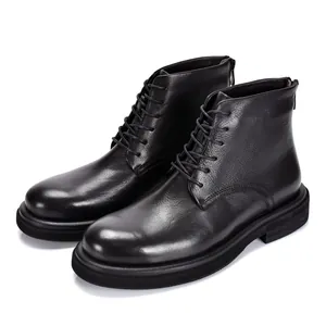 Macro view of black genuine leather high-top Martens boots with lace-up and zipper details