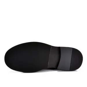 Detailed macro view of the anti-slip black rubber sole for men's leather boots