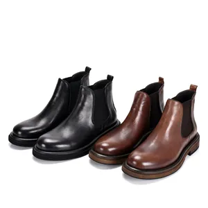 Two pairs of classic men's leather Chelsea boots in black and brown colors