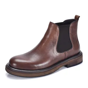 Detailed side view of vintage brown leather Chelsea boots with thick sole for men
