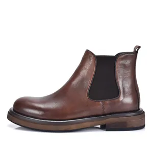Side profile view of a premium brown leather Chelsea boot with a vintage thick sole