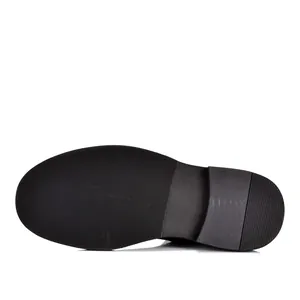 Detailed view showing the durable anti-slip rubber outsole of a men's Chelsea boot
