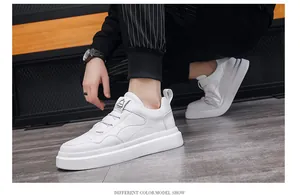 Detail shot of men's low-top white casual sneakers featuring a clean minimalist design