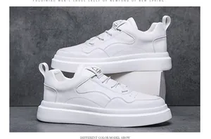 Detailed side view of stylish white men's low-top sneakers on a grey background.