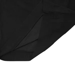Macro detail view of the side slit hem on a premium black corduroy sweatshirt for men