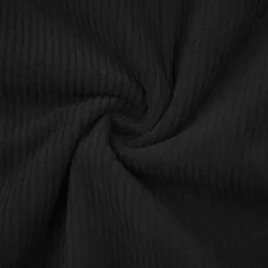 Close-up macro view showing the soft texture and ribbed detail of black corduroy fabric
