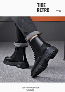 Close-up shot of men's black lace-up Martin boots with thick sole and side zipper