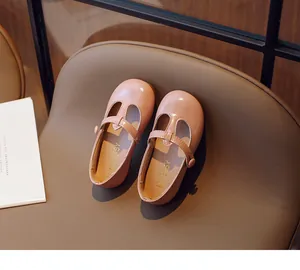 Detailed macro view of pink T-strap girl's leather shoes with MG BABY logo on insole