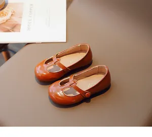 Classic girls brown faux leather toddler shoes featuring round toe and T-strap velcro