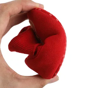 Flexible red soft-sole baby winter sock shoe showing extreme softness and comfort