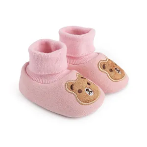Pink soft sole baby booties with cute cartoon bear embroidery for winter indoor warmth