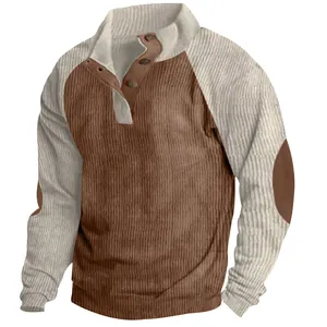 Close-up detail of an autumn men's corduroy sweatshirt with color-block raglan sleeves.