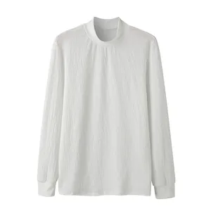 Close-up of white men's mock neck shirt with unique water ripple knit texture detail