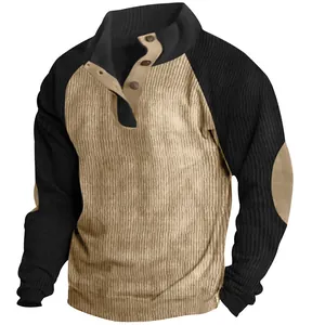 Close-up of contrast color corduroy sweatshirt with stand-up collar and button detail