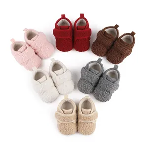 Collection of warm fleece baby walking shoes in various colors for winter season
