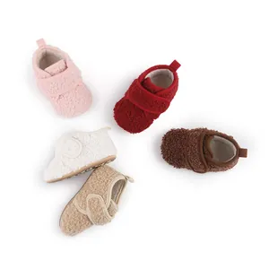 Detailed view of cozy sherpa fleece baby shoes in pink, red, white, brown and tan colors