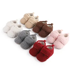 Six pairs of colorful plush fleece baby booties for winter warmth and first steps