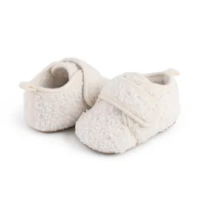 Detailed close-up showing soft white fleece texture of winter plush baby walker shoes
