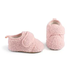 Side and front view of soft pink sherpa fleece baby winter walking shoes for infants