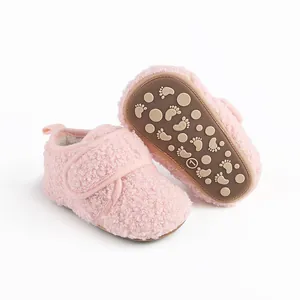 Macro view of pink sherpa baby winter walking shoes with anti-slip sole