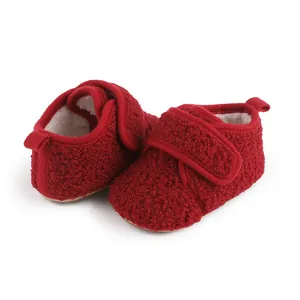 Close-up of cozy red fleece-lined winter walking shoes for infants and toddlers