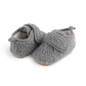 Close-up view of grey fuzzy fleece baby walker shoes featuring warm thickened lining