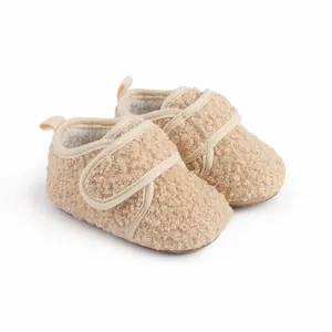 Macro view of plush sherpa fleece texture on warm winter baby pre-walker shoes