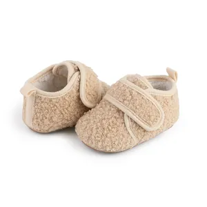 Soft fuzzy beige baby walking shoes with warm fleece lining and easy velcro strap closure