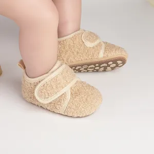 Close-up shot of cozy beige fleece-lined baby winter walking shoes on a child's feet