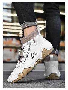 Close-up of men's white casual mid-cut sock boots with unique textured sole
