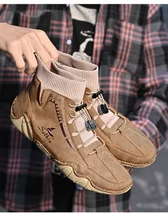 Detailed shot of brown mid-top casual sock boots with knit collar for men outdoor use