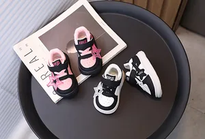 Stylish toddler winter sneakers with warm fleece lining and star charms on a tray