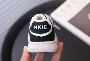 Close-up detail of children's winter warm sneaker heel featuring soft white fur lining
