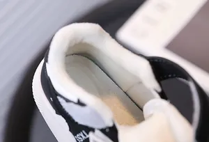 Close-up view of the thick warm white fleece lining inside children's winter sneakers