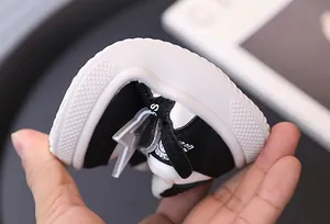 Macro view showing the highly flexible and soft rubber sole of these warm children sneakers