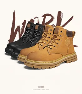 Detailed view of classic tan and black outdoor leather work boots for men