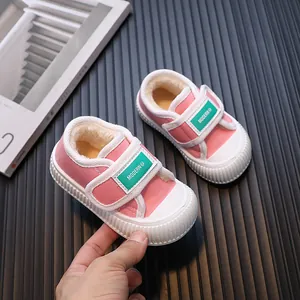 Cozy pink toddler canvas sneakers with warm fleece lining and green velcro straps