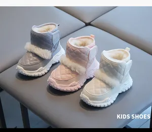 Three pairs of cozy kids winter snow boots in grey, pink, and beige with faux fur trim