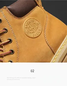 Close-up of durable yellow work boots showing stitching and leather texture details.